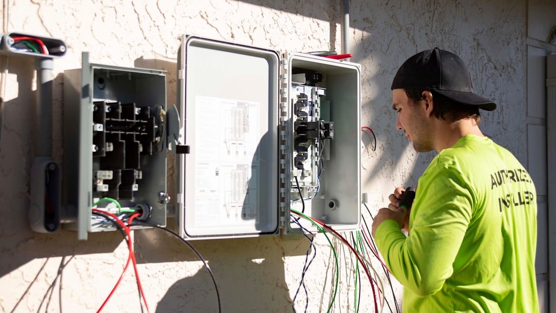 Technician adjusting live signal distribution equipment