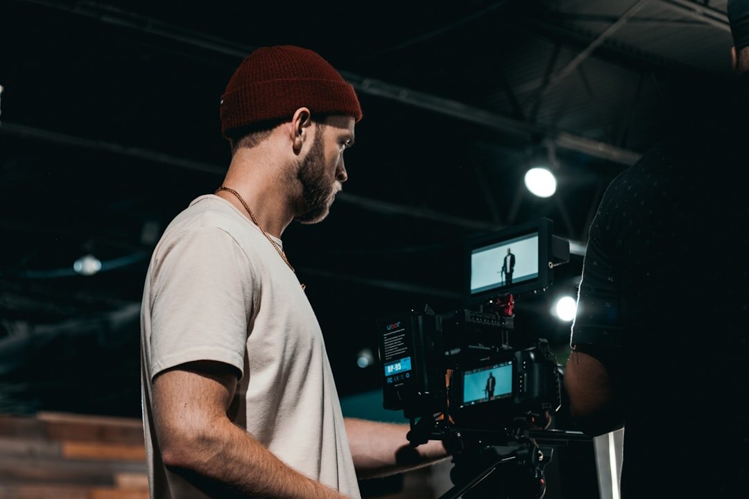 Camera operator filming in a television studio